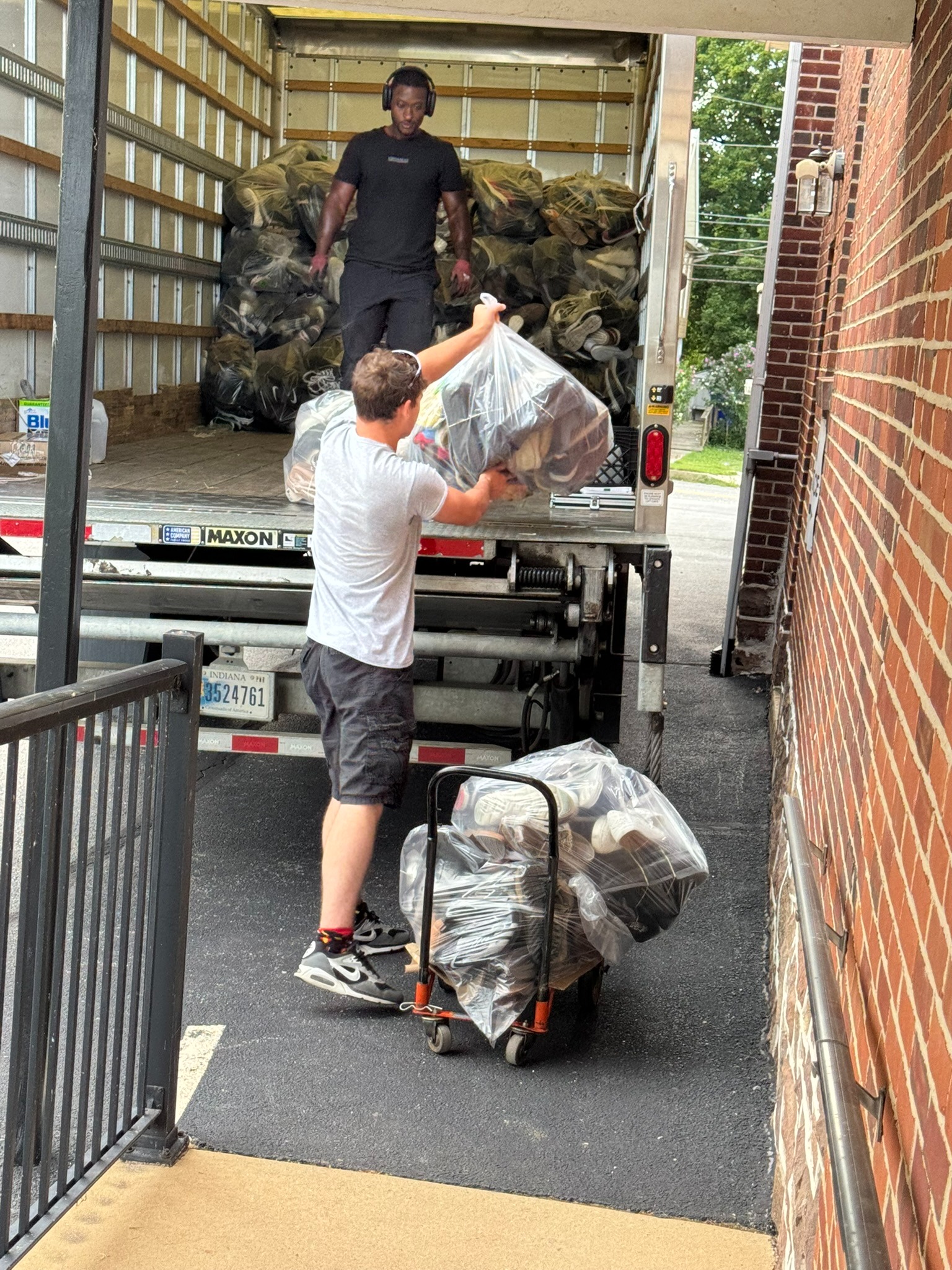 Shoe drive bags being loaded into the pickup truck